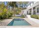 Beautiful backyard with a refreshing pool, patio, and a well-maintained lawn at 4614 W Lowell Ave, Tampa, FL 33629