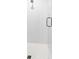 Modern shower with white tile and glass door at 4614 W Lowell Ave, Tampa, FL 33629