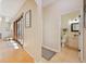 Welcoming hallway leading to a bathroom with modern fixtures, and sliding glass doors with ample natural light at 5404 Garden Arbor Dr, Lutz, FL 33558