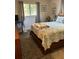 Comfortable bedroom featuring a cozy bed with decorative quilt and natural light at 5553 Baywater Dr, Tampa, FL 33615
