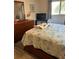 Comfortable bedroom featuring a cozy bed with decorative quilt and natural light at 5553 Baywater Dr, Tampa, FL 33615