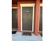Condo front door with visible unit number and welcome mat, offering a secure entry at 5553 Baywater Dr, Tampa, FL 33615