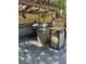 Outdoor grilling area with well-maintained grills, countertop space, and trash receptacle at 5553 Baywater Dr, Tampa, FL 33615
