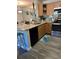 Modern kitchen with stainless steel appliances, granite countertops, and ample cabinet space at 5553 Baywater Dr, Tampa, FL 33615