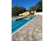 Community pool area featuring inviting lounge chairs for relaxing by the pool at 5553 Baywater Dr, Tampa, FL 33615