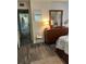 Bedroom with wood floors leading to kitchen showcasing furniture and decor at 5553 Baywater Dr, Tampa, FL 33615