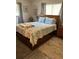 A cozy bedroom provides a comfortable bed with bedside tables for decor and storage at 5553 Baywater Dr, Tampa, FL 33615