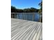 Stunning lake view from a wooden deck with steel railing at 5553 Baywater Dr, Tampa, FL 33615