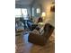 Bright living room with sliders to screened lanai, coastal decor, and neutral furniture at 5553 Baywater Dr, Tampa, FL 33615
