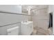 Bright bathroom featuring a shower, sink and toilet at 6013 N Grady Ave, Tampa, FL 33614