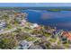 Waterfront property with boat dock, featuring lush landscaping and panoramic bay views from an elevated perspective at 6151 Bayou Grande Ne Blvd, St Petersburg, FL 33703