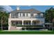 Luxurious backyard with a sparkling pool, a covered terrace, and manicured greenery for ultimate relaxation at 6151 Bayou Grande Ne Blvd, St Petersburg, FL 33703