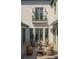 Intimate courtyard with wicker seating, elegant lamps, and detailed tile flooring at 6151 Bayou Grande Ne Blvd, St Petersburg, FL 33703