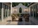 Inviting outdoor courtyard with cozy seating, decorative tile flooring, and custom lighting at 6151 Bayou Grande Ne Blvd, St Petersburg, FL 33703