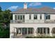 The second-story of this lovely home has many well-placed windows and a charming balcony at 6151 Bayou Grande Ne Blvd, St Petersburg, FL 33703