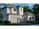 Elegant home with a two-car garage, professional landscaping, and a covered entry for added curb appeal at 6151 Bayou Grande Ne Blvd, St Petersburg, FL 33703