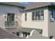 Detailed view of home exterior with custom balcony and inviting outdoor lighting at 6151 Bayou Grande Ne Blvd, St Petersburg, FL 33703