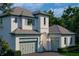 Charming home with a two-car garage, and a one-car garage, complemented by lush landscaping at 6151 Bayou Grande Ne Blvd, St Petersburg, FL 33703