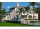 Luxury home with large balconies overlooking the pool and manicured backyard at 6151 Bayou Grande Ne Blvd, St Petersburg, FL 33703