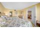 Comfortable bedroom with a mirrored dresser, twin beds with decorative quilt, and an ensuite bathroom at 6357 Bahia Del Mar Blvd # 206, St Petersburg, FL 33715
