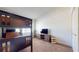 Bedroom featuring a twin bunk bed, complemented by a wooden TV stand and natural light at 64 Pelican Pl, Belleair, FL 33756