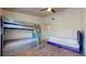 Bedroom with a twin bunk bed and a full-sized bed at 64 Pelican Pl, Belleair, FL 33756