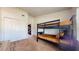Comfortable bedroom featuring a twin bunk bed and large closet for storage at 64 Pelican Pl, Belleair, FL 33756