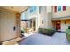 Welcoming courtyard with outdoor seating, a red brick accent wall, and a well-maintained exterior at 64 Pelican Pl, Belleair, FL 33756