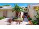 Charming townhome with well-maintained landscaping, a private entrance, and an attached garage at 64 Pelican Pl, Belleair, FL 33756