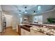 This stunning kitchen features sleek countertops and modern cabinetry at 64 Pelican Pl, Belleair, FL 33756