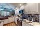 This beautifully updated kitchen showcases updated countertops, modern cabinetry, and stainless steel appliances at 64 Pelican Pl, Belleair, FL 33756