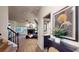 Inviting living room with a cozy fireplace and large window providing natural light at 64 Pelican Pl, Belleair, FL 33756