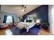 Spacious main bedroom with a vaulted ceiling, ample natural light, and stylish decor at 64 Pelican Pl, Belleair, FL 33756