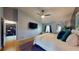 Large main bedroom with walk-in closet, en-suite bathroom, and natural light streaming through the window at 64 Pelican Pl, Belleair, FL 33756
