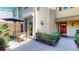 Cozy patio area with a table and chairs, perfect for outdoor dining and relaxation with access to the home's entry at 64 Pelican Pl, Belleair, FL 33756