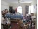 Spacious bedroom featuring a ceiling fan, shelving, and plenty of natural light at 6473 Blackbird Ave, Weeki Wachee, FL 34613