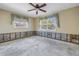 Bedroom, under renovation, with two windows and plumbing ready for reconstruction at 6804 Sea Gull S Dr, St Petersburg, FL 33707