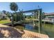 Waterfront home featuring a private dock with boat lift and quick water access at 6804 Sea Gull S Dr, St Petersburg, FL 33707