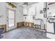 Functional laundry room with storage cabinets and a utility sink, offering convenience and practicality at 6804 Sea Gull S Dr, St Petersburg, FL 33707