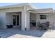 Covered patio with awning, patio furniture, and lush landscaping creates an ideal outdoor space at 715 44Th Ne Ave, St Petersburg, FL 33703