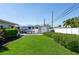 Picturesque backyard with lush lawn, RV parking area, storage shed, and privacy fence at 715 44Th Ne Ave, St Petersburg, FL 33703