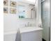 Clean bathroom featuring a large vanity, framed artwork, and a glass-enclosed shower for a refreshing experience at 715 44Th Ne Ave, St Petersburg, FL 33703