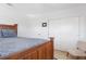 Cozy bedroom featuring a bed, closet, and natural light streaming in from a window, set on hardwood flooring at 715 44Th Ne Ave, St Petersburg, FL 33703