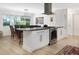Eat-in kitchen with stainless steel oven and vent hood, with bright sunny windows near the dining area at 715 44Th Ne Ave, St Petersburg, FL 33703