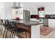 Well designed kitchen with stainless steel appliances, a modern vent hood, and concrete countertops at 715 44Th Ne Ave, St Petersburg, FL 33703