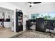 Home office area with built-in bookcase, modern desk, and adjacent to the kitchen with an open floor plan at 715 44Th Ne Ave, St Petersburg, FL 33703