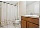 Cozy bathroom featuring a shower-tub combo with a neutral-toned shower curtain and a single sink vanity at 7233 Lumber Port Dr, Ruskin, FL 33573