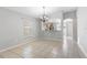 The dining room features tiled flooring, neutral walls, and a clear view to the kitchen at 7233 Lumber Port Dr, Ruskin, FL 33573