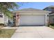Charming single-Gathering home with a two-car garage and well-maintained front yard at 7233 Lumber Port Dr, Ruskin, FL 33573