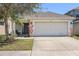 Charming single-Gathering home featuring a two-car garage and well-maintained front yard at 7233 Lumber Port Dr, Ruskin, FL 33573